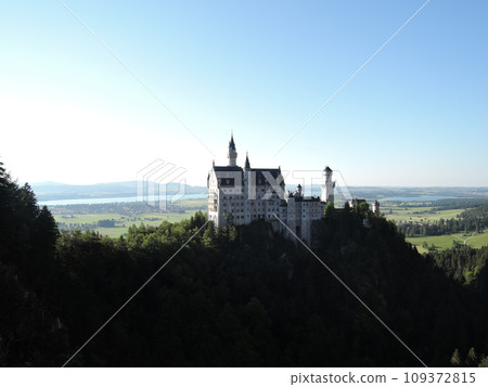 Neuschwanstein Castle is a 19th century historicist palace on a rugged hill above the village of Hohenschwangau near Fussen in southwest Bavaria, Germany. Neuschwanstein Castle is a 19th century historicist palace on a rugged hill above the village of Hohenschwangau near Fussen in southwest Bavaria, Germany. 109372815