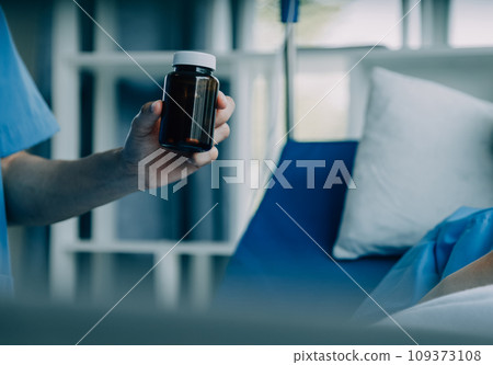 Doctor telling to patient woman the results of her medical tests. Doctor showing medical records to cancer patient in hospital ward. Senior doctor explaint the side effects of the intervention. 109373108