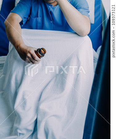 Doctor telling to patient woman the results of her medical tests. Doctor showing medical records to cancer patient in hospital ward. Senior doctor explaint the side effects of the intervention. 109373121