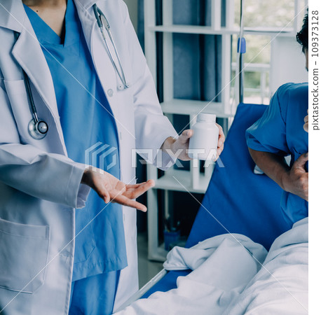 Doctor telling to patient woman the results of her medical tests. Doctor showing medical records to cancer patient in hospital ward. Senior doctor explaint the side effects of the intervention. 109373128