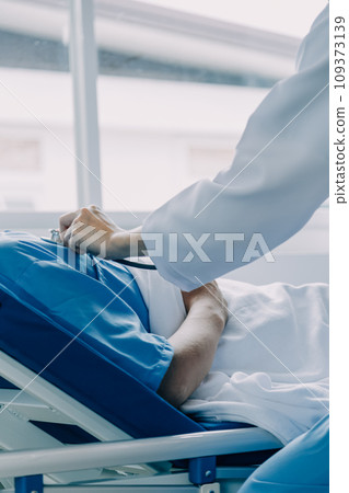 Doctor telling to patient woman the results of her medical tests. Doctor showing medical records to cancer patient in hospital ward. Senior doctor explaint the side effects of the intervention. 109373139