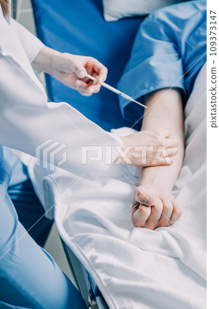 Doctor telling to patient woman the results of her medical tests. Doctor showing medical records to cancer patient in hospital ward. Senior doctor explaint the side effects of the intervention. 109373147