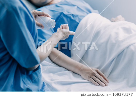 Doctor telling to patient woman the results of her medical tests. Doctor showing medical records to cancer patient in hospital ward. Senior doctor explaint the side effects of the intervention. 109373177