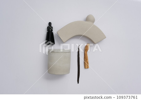 Unlabeled scented candle jar presented on a white background with decorations. Blank space for text design. Scented candles, a popular choice for enhancing and fragrancing any space. Unlabeled scented candle jar presented on a white background with decorations. Blank space for text design. Scented candles, a popular choice for enhancing and fragrancing any space. 109373761