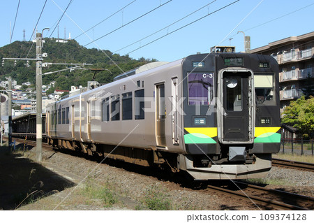 Muroran Main Line local train departing from Muroran Station with Mt. Souroku in the background Muroran Line local train local 109374128