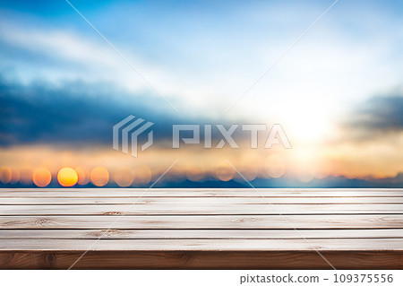 Empty wood tabletop or counter with display product. Blur image of blue sky and hill background. Display product background Empty wood tabletop or counter with display product. Blur image of blue sky and hill background. Display product background 109375556
