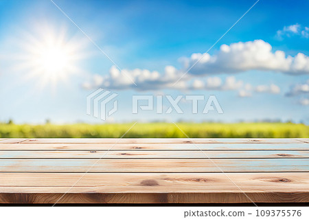 Empty wood tabletop or counter with display product. Blur image of blue sky and hill background. Display product background Empty wood tabletop or counter with display product. Blur image of blue sky and hill background. Display product background 109375576