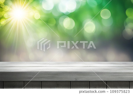 Empty wood tabletop or counter with display product. Blur image of green leaves bokeh background. Display product background concept Empty wood tabletop or counter with display product. Blur image of green leaves bokeh background. Display product background concept 109375823