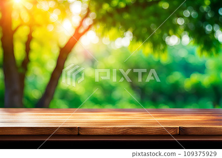 Empty wood tabletop or counter with display product. Blur image of green leaves bokeh background. Display product background concept Empty wood tabletop or counter with display product. Blur image of green leaves bokeh background. Display product background concept 109375929