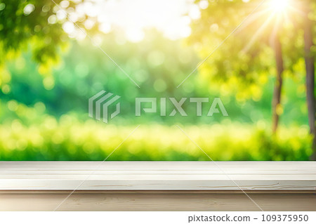 Empty wood tabletop or counter with display product. Blur image of green leaves bokeh background. Display product background concept Empty wood tabletop or counter with display product. Blur image of green leaves bokeh background. Display product background concept 109375950