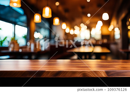 Empty wood tabletop or counter with display product. Blur image of restaurant,coffee shop background. Display product background concept Empty wood tabletop or counter with display product. Blur image of restaurant,coffee shop background. Display product background concept 109376126