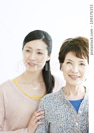 Portrait of smiling grandmother and daughter Portrait of smiling grandmother and daughter 109376355