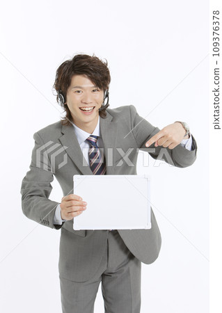 A businessman with a message board A businessman with a message board 109376378