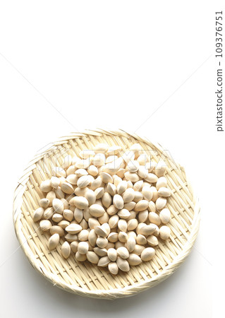 An overhead shot of ginkgo seeds in a basket against a white background An overhead shot of ginkgo seeds in a basket against a white background 109376751