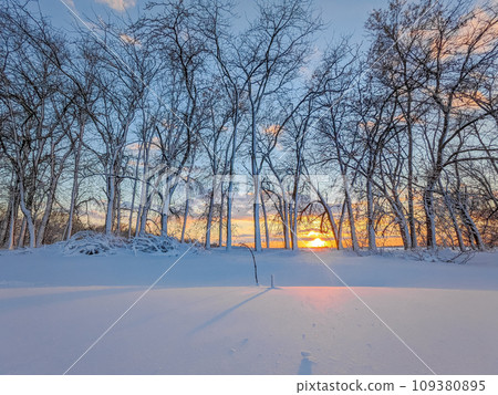 Country winter landscape at sunset Country winter landscape at sunset 109380895