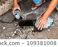 A technician is sharpening a knife for use in construction work. 109381008