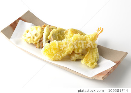 Assorted tempura of shrimp, chikuwa, green beans, pumpkin, sweet potato, and lotus root photographed against a white background Assorted tempura of shrimp, chikuwa, green beans, pumpkin, sweet potato, and lotus root photographed against a white background 109381744