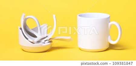 Broken cup isolated on a solid background Broken cup isolated on a solid background 109381847