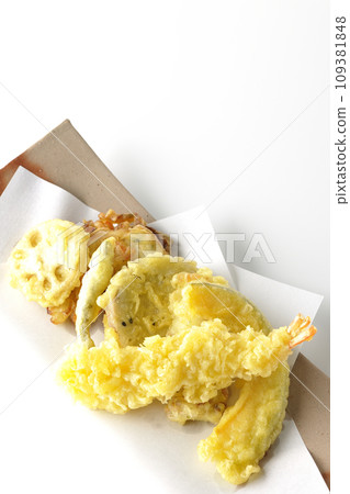 An overhead shot of an assortment of shrimp, chikuwa, green beans, pumpkin, sweet potato, and lotus root tempura against a white background An overhead shot of an assortment of shrimp, chikuwa, green beans, pumpkin, sweet potato, and lotus root tempura against a white background 109381848