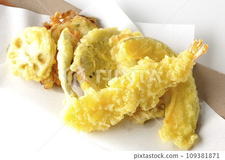 An overhead shot of an assortment of shrimp, chikuwa, green beans, pumpkin, sweet potato, and lotus root tempura against a white background An overhead shot of an assortment of shrimp, chikuwa, green beans, pumpkin, sweet potato, and lotus root tempura against a white background 109381871