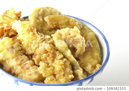 A photo of a tempura bowl with lots of ingredients such as shrimp, chikuwa, green beans, pumpkin, sweet potato, and lotus root on a white background A photo of a tempura bowl with lots of ingredients such as shrimp, chikuwa, green beans, pumpkin, sweet potato, and lotus root on a white background 109382331