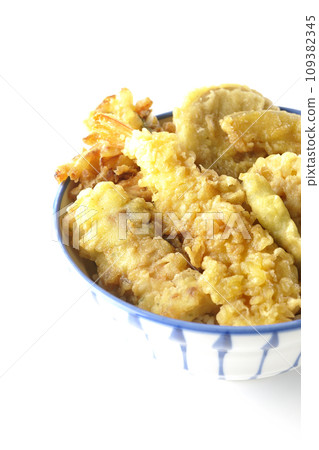 A photo of a tempura bowl with lots of ingredients such as shrimp, chikuwa, green beans, pumpkin, sweet potato, and lotus root on a white background 109382345