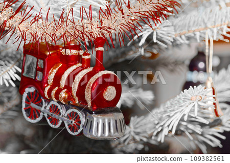 Red train as Christmas tree decoration Red train as Christmas tree decoration 109382561