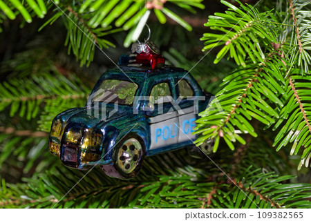 Police car hanging on Christmas tree as decoration 109382565