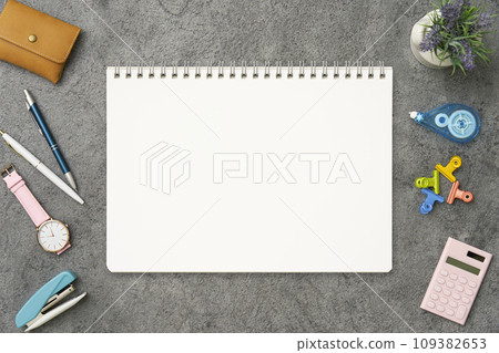 Notebook on desk overhead shot Notebook on desk overhead shot 109382653