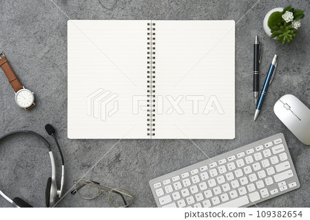 Notebook on desk overhead shot Notebook on desk overhead shot 109382654