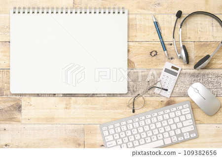 Notebook on desk overhead shot Notebook on desk overhead shot 109382656