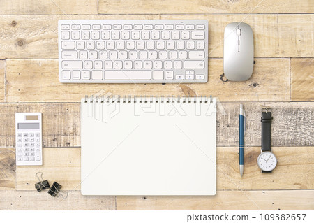Notebook on desk overhead shot Notebook on desk overhead shot 109382657