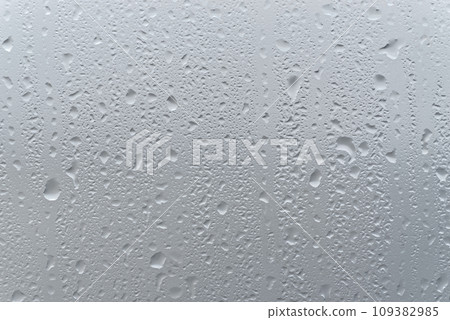 Water drops on a window glass Water drops on a window glass 109382985