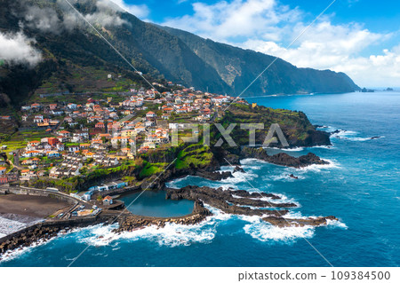 Aerial view of Madeira island. Land meets ocean in Seixal, Madeira, Portugal Aerial view of Madeira island. Land meets ocean in Seixal, Madeira, Portugal 109384500