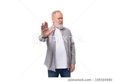 cute smart grandfather with a white beard and mustache dressed in a striped shirt over a t-shirt 109384990