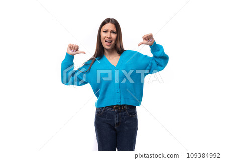 active stylish young brunette lady dressed in blue casual sweater 109384992