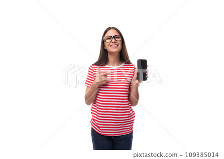 beautiful young caucasian woman with straight hair with glasses and in a striped t-shirt is holding beautiful young caucasian woman with straight hair with glasses and in a striped t-shirt is holding 109385014