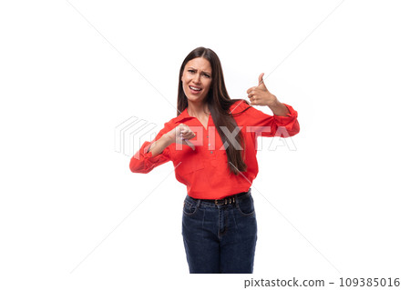 pretty young brunette business woman dressed in a red blouse doubts and hesitates in a decision on a 109385016