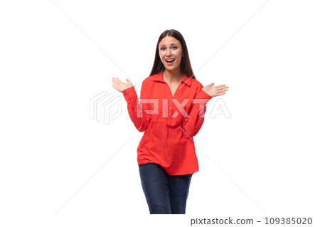 beautiful young business woman with black hair dressed in a red shirt posing energetically on a beautiful young business woman with black hair dressed in a red shirt posing energetically on a 109385020