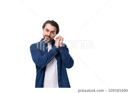 nice kind young brunette man in denim shirt nice kind young brunette man in denim shirt 109385890