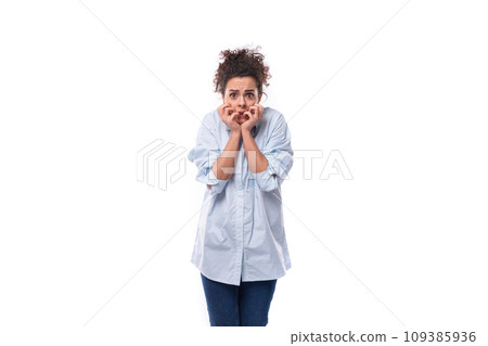 brunette curly young employee of a business company woman dressed in a light blue shirt on a white 109385936