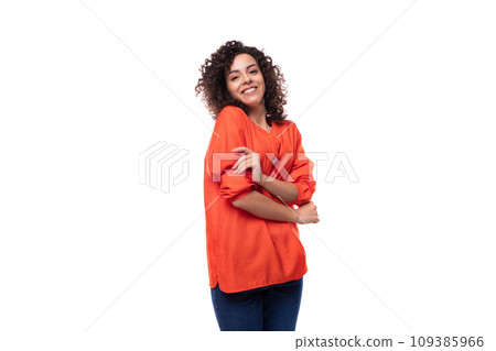 young cheerful caucasian lady with curly hair style dressed in orange shirt young cheerful caucasian lady with curly hair style dressed in orange shirt 109385966