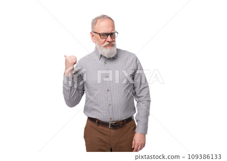 stylish mature gray-haired office worker man with a mustache and beard dressed in trousers and a stylish mature gray-haired office worker man with a mustache and beard dressed in trousers and a 109386133