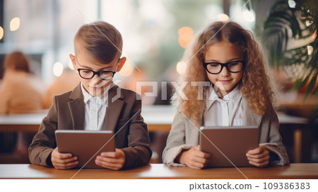 Girl And Boy Using Tablet at School Girl And Boy Using Tablet at School 109386383