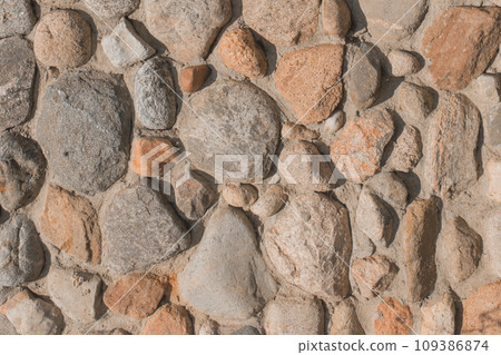 Stones cobblestones in cement wall solid texture background rough Stones cobblestones in cement wall solid texture background rough 109386874