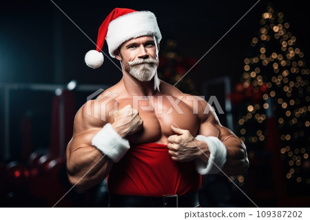 Santa Claus fitness trainer. A muscular man in a gym Santa Claus fitness trainer. A muscular man in a gym 109387202