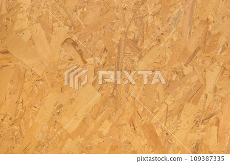 Chipboard light yellow osb surface pressed wood pattern texture particleboard background construction material 109387335