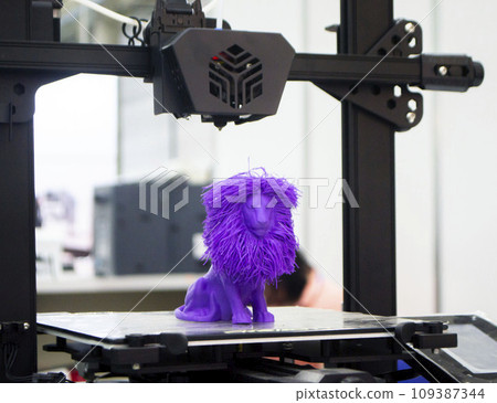 Model of toy lion printed on 3D printer from melted plastic blue color on desktop of 3D printer. Concept 3D printer, 3D printing, modeling prototyping three dimensional object. Innovative production Model of toy lion printed on 3D printer from melted plastic blue color on desktop of 3D printer. Concept 3D printer, 3D printing, modeling prototyping three dimensional object. Innovative production 109387344
