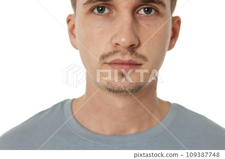 portrait of young calm man on white background portrait of young calm man on white background 109387748