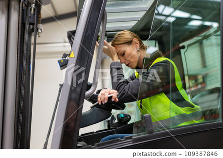 Female warehouse worker driving forklift. Warehouse worker preparing products for shipmennt, delivery, checking stock in warehouse. Female warehouse worker driving forklift. Warehouse worker preparing products for shipmennt, delivery, checking stock in warehouse. 109387846
